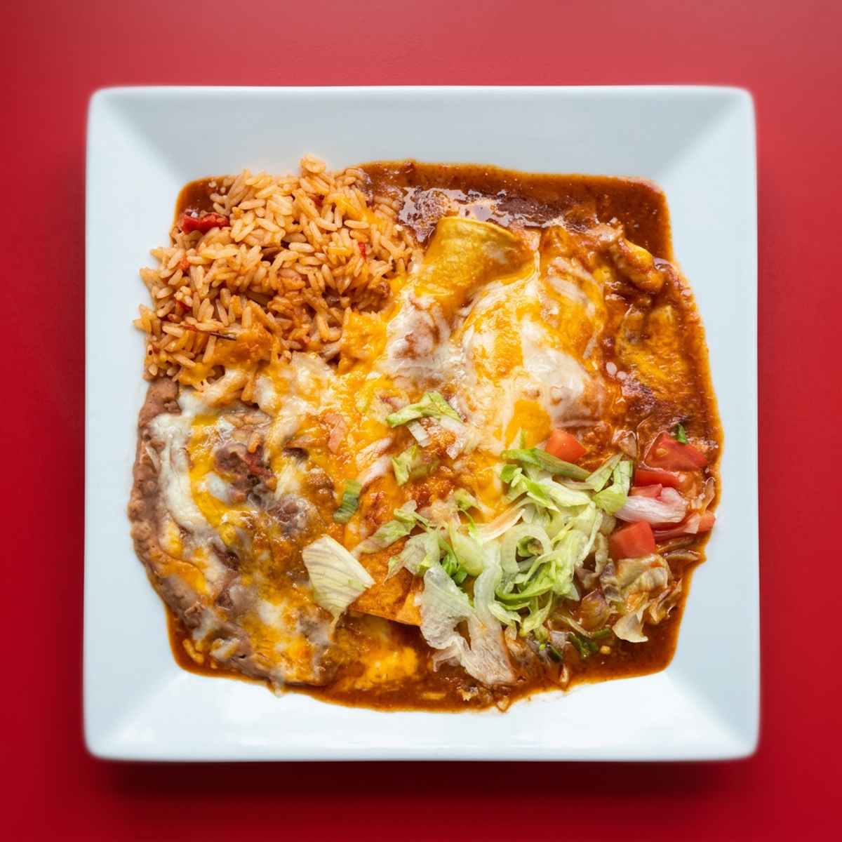 L. Two Cheese Enchiladas with Spanish Rice and Refried Beans